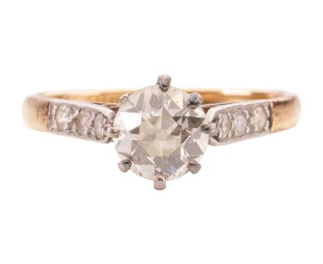 A diamond solitaire ring. The principal old European-cut diamond weighs approximately 0.71cts, estimated colour and clarity K
