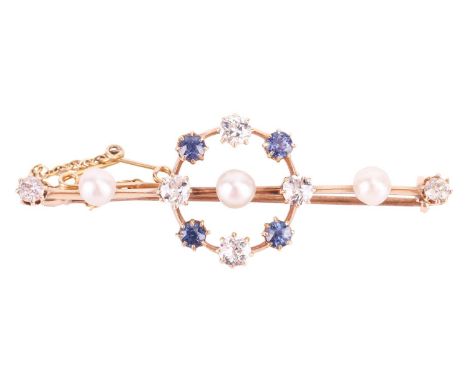 A gem-set bar brooch, knife-edged bar comprising three round pearls of 4.5 mm, the central pearl encircled by a surround set 