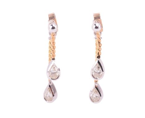 A pair of diamond drop earrings, each containing two pear-cut diamonds on serpent chains, one dangling from the ear post, ano