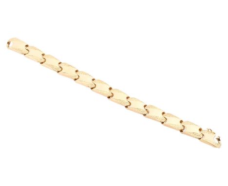 A fancy curb link chain, panels part textured, finished with a figure-of-eight clasp, yellow metal marked '750', length measu