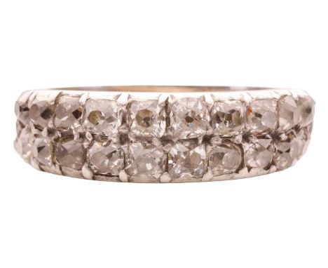 A two-row old cut diamond ring, featuring two rows of old cut diamonds in a Georgian head of silver and gold on a modern plat