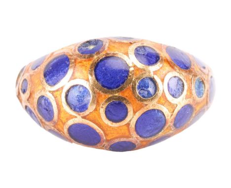 An enamel ring, the bombe design featuring blue enamel circles to an orange enamel ground, the shank stamped '750', ring size