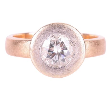A diamond solitaire ring, set with a round brilliant cut diamond with an estimated weight of 1.35ct, in a wide bezel setting 