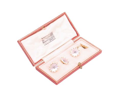 A pair of mother of pearl and diamond cufflinks, of concave circular form, each mother of pearl panel centred with an old-cut