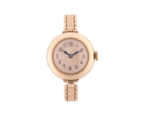 A 9ct gold lady's dress watch, featuring a Swiss-made hand-wound movement in a yellow metal case stamped 9ct gold and measuri