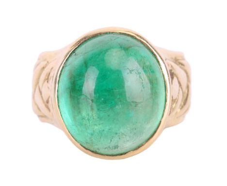 A cabochon emerald dress ring in 18ct yellow gold, featuring an oval emerald cabochon of 13.7 x 12.2 x 8.0 mm, in a collet se