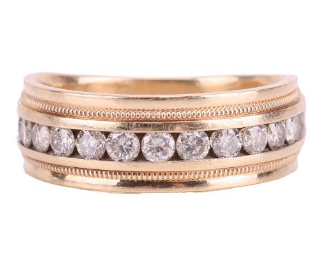 A diamond half hoop ring, set with a row of twelve round brilliant cut diamonds in a channel setting, with a total estimated 