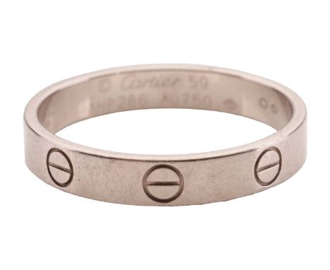 Cartier - a 'Love' ring with polished 18ct white gold band, decorated with screw head motifs, signed and numbered, Swiss conv