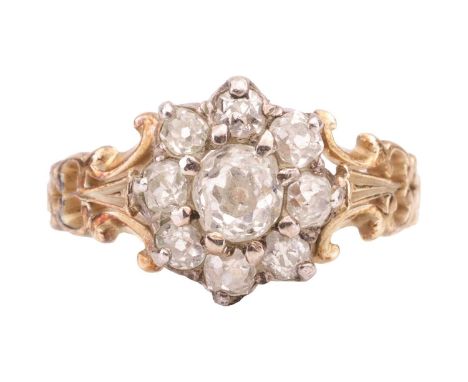 An old-cut diamond flowerhead cluster ring, centred with an oval old-cut diamond approximately measures 4.7 x 4.2 x 3.0 mm, c