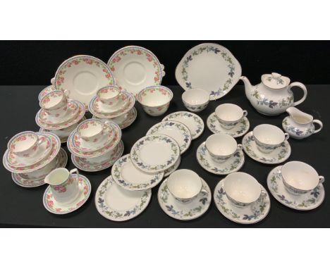 A Royal Doulton 'Burgundy' pattern tea service for six;  an Adderleys  'Roses' pattern tea service for nine, (2). 