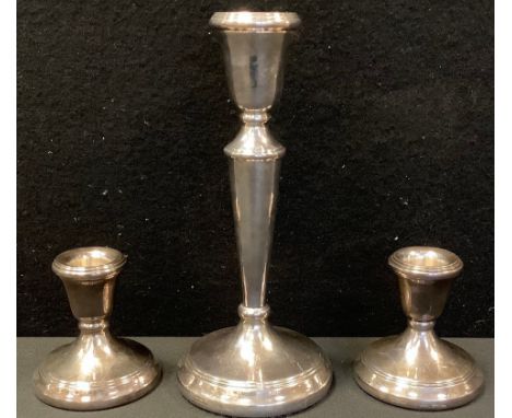 A silver table candlestick, bell shaped sconce, 19cm high, David Shaw Silverware Ltd, Birmingham 1982;  a pair of similar bou