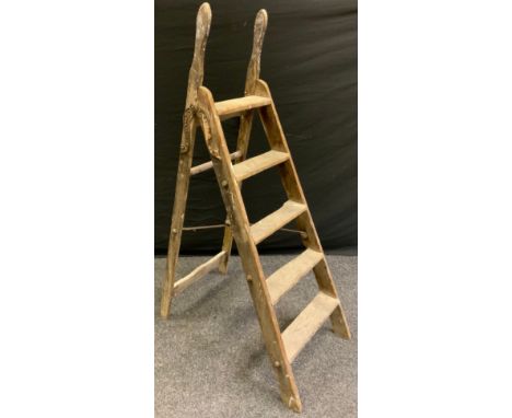 A 'Self Acting Stop' folding wooden step ladder 