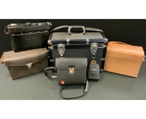 Camera accessories - A Leitz Wetzlar (Leica) brown leather camera-case, and another in black leather;  a Hasselblad, pale tan