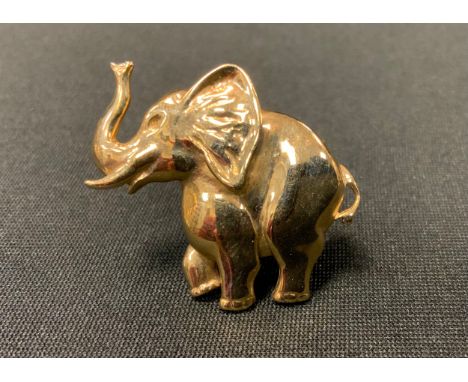 A 9ct gold Elephant brooch, trunk erect, Sheffield 1994, 6.6g gross 