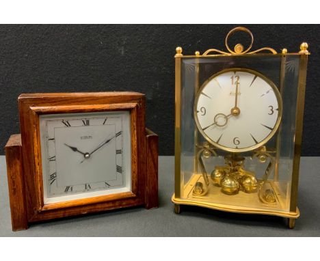 A 1930 oak mantel clock, Sterling Electric;  a Kundo brass perpetual clock 