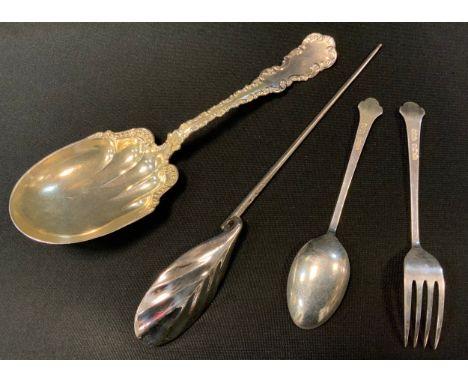 An early 20th century mote spoon, Brook &amp; Son, Edinburgh 1933;  a Sterling silver gilt cream spoon, fancy handle, marked 