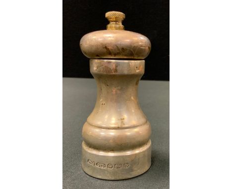 A silver pepper grinder of traditional slender waisted cylindrical form, 10cm high 