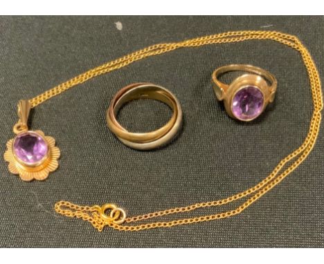 An amethyst pendant necklace, 9ct gold mount and chain;  similar dress ring;  a 9ct gold three colour interlaced wedding band