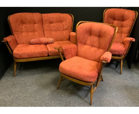 An Ercol Windsor three piece suite, comprising a double seated sofa and two arm chairs.(3) 