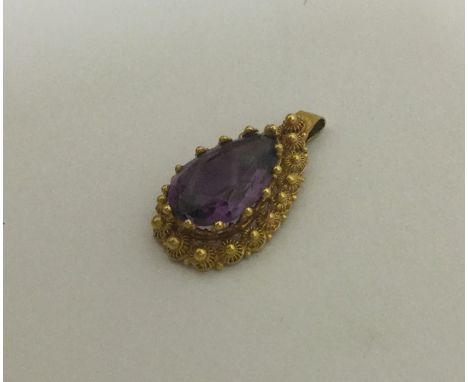 A Victorian high carat gold amethyst pendant. Approx. 2.8 grams. Est. £50 - £80.