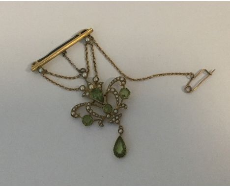 A Victorian peridot and pearl brooch on bar. Approx. 9.1 grams. Est. £300 - £400.
