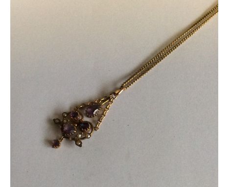 A stylish 15 carat amethyst and pearl pendant with chain suspension to loop top. Approx. 5.3 grams. Est. £100 - £150.