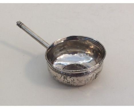 An unusual silver toddy ladle with coin centre. Approx. 34 grams. Est. £30 - 340.