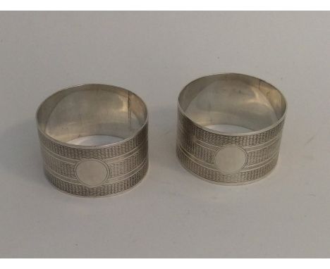 A good pair of engine turned silver napkin rings. Chester 1929. Approx. 45 grams. Est. £45 - £50.