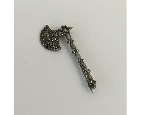 An Antique cut steel brooch in the form of a Medieval axe. Approx. 7.3 grams. Est. £40 - £50.