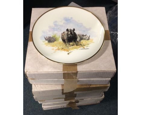 Eight large boxed commemorative plates. Est. £20 - £30.