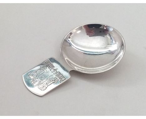 A silver caddy spoon decorated with The Prince of Wales Feathers. Birmingham. By T&amp;S. Approx. 18 grams. Est. £35 - £45.