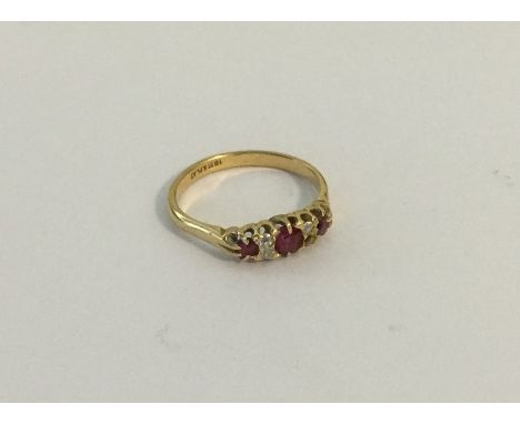 A Victorian ruby and diamond ring in 18 carat claw mount. Approx. 2.7 grams. Est. £100 - £200.