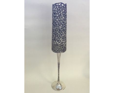 STUART DEVLIN: A tall silver candlestick with gilded shade of textured form. Approx. 41 cms high. Approx. 420 grams. Est. £15