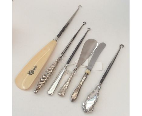 A collection of various silver button hooks. Est. £20 - £30.