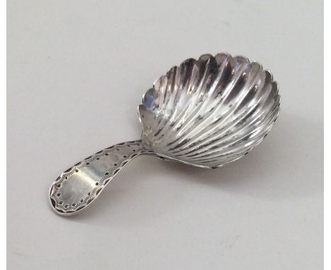 EXETER: A bright cut silver caddy spoon with fluted bowl. By Richard Ferris. Approx. 8 grams. Est. £50 - £80.