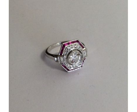 A good quality 18 carat gold ruby and diamond Art Deco style cluster ring in 18 carat white gold. Approx. 4.5 grams. Est. £25