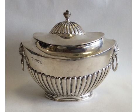 A Victorian silver Adams' style tea caddy with lion mask handles. London. Approx. 190 grams. Est. £100 - £150.