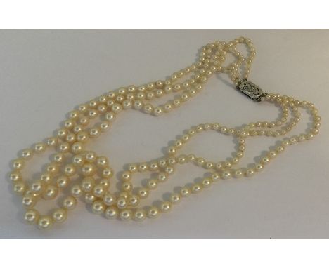A good graduated three row pearl necklace. Approx. 50 grams. Est. £250 - £350.