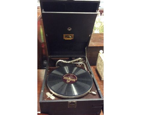 An old HMV record player. Est. £20 - £30.