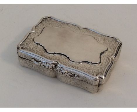 A Georgian silver snuff box attractively decorated with scrolls and flowers and hinged lid. Birmingham. By Nathaniel Mills. A