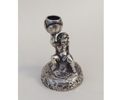 An attractive taper candlestick in the form of a child on rugged landscape. London 1850. By Charles Fox. Approx. 82 grams. Es