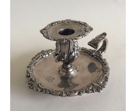 A good Victorian silver chamber stick with crested decoration. London 1837. By Robert Garrard. Approx. 185 grams. Est. £150 -