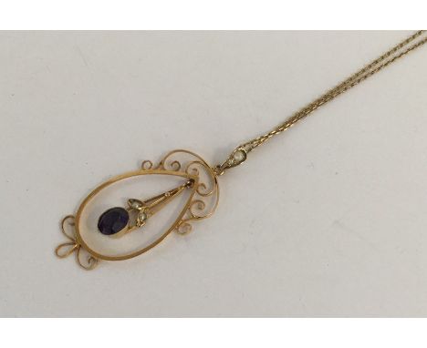 An amethyst and pearl drop pendant with loop top on fine link chain. Approx. 4.3 grams. Est. £100 - £200.