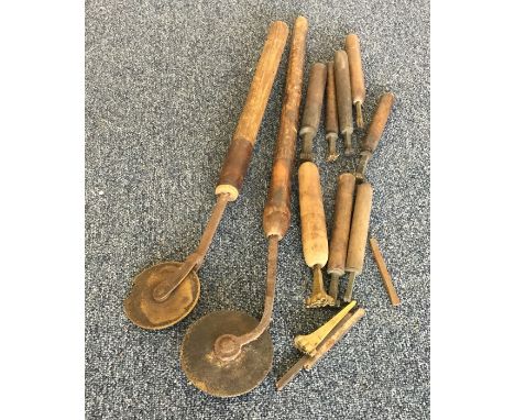 A collection of leather cutting tools and seals. Est. £15 - £20.