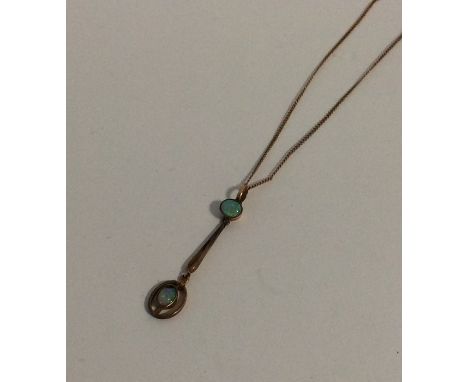 A 9 carat opal tow stone pendant on fine link chain. Approx. 2.4 grams. Est. £70 - £80.