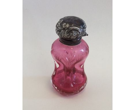 An unusual cranberry glass and silver mounted scent bottle in the form of a decanter. Birmingham. Est. £40 - £60. 