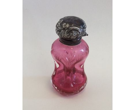 An unusual cranberry glass and silver mounted scent bottle in the form of a decanter. Birmingham. Est. £40 - £60. 