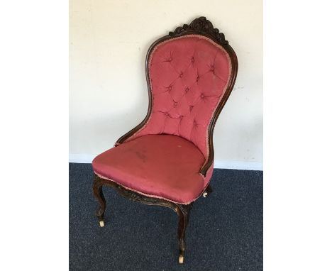 A Victorian mahogany button back chair with scroll decoration. Est. £50 - £80.