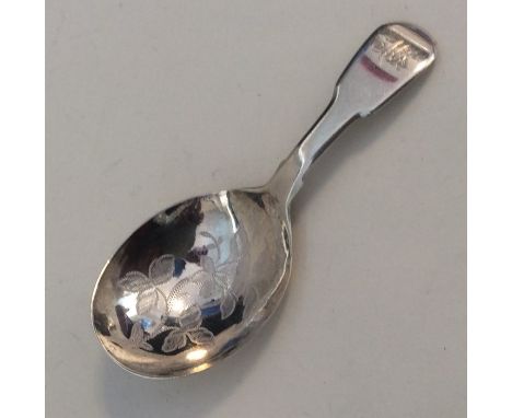 An attractive fiddle pattern silver caddy spoon with floral decoration. London. By JB. Approx. 12 grams. Est. £50 - £80.