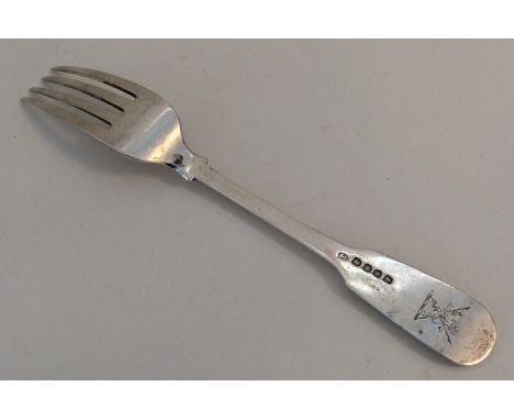 PAUL STORR: A large crested silver table fork. London 1818. Approx. 79 grams. Est. £80 - £120.
